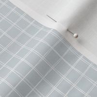 Medium | Minimalist hand drawn white grid lines on light blue grey