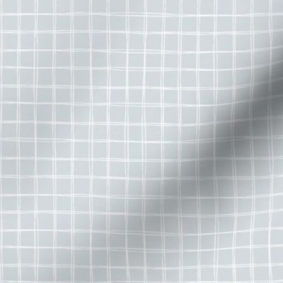 Medium | Minimalist hand drawn white grid lines on light blue grey
