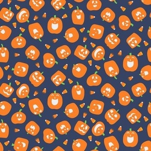 Tossed Laughing Funny Halloween Pumpkins with Light White Faces and Candy Corn on Blue Background Non Directional Small Scale