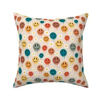 Medium Scale Retro Drippy Melting Smile Faces and Daisy Flowers on Sand
