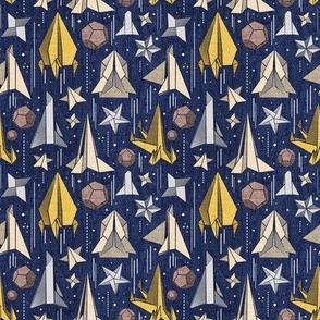 Tiny scale // Reaching for the stars // navy blue background ivory grey brown and yellow origami paper asteroids stars and space ships traveling light speed