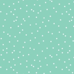 Christmas confetti, small random dots on mint green  background, small scale