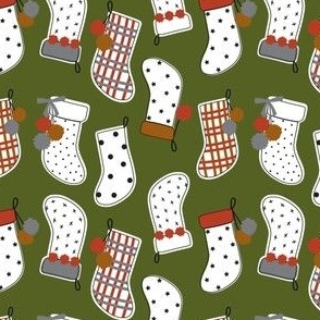 Cute Christmas red and green magnolia farmhouse stockings on green