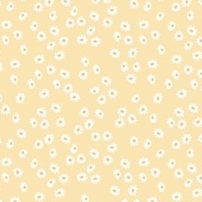 Tossed Small Daisies on Light Yellow Background