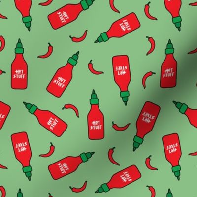 (S Scale) Hot Stuff | Hot Sauce Bottle with Peppers Scattered on Green