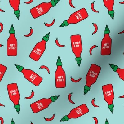 (S Scale) Hot Stuff | Hot Sauce Bottle with Peppers Scattered on Light Blue