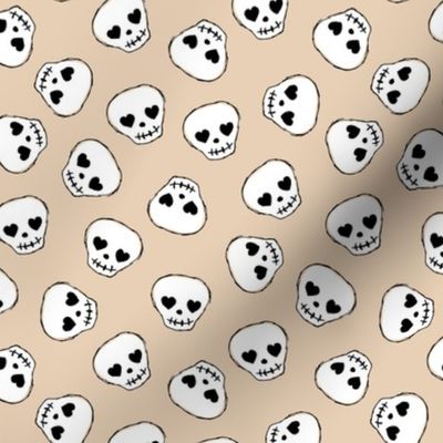 Little day of the dead love skulls halloween kids design on soft beige sand