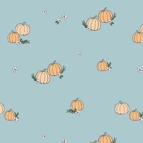 Boho fall pumpkins and flowers with vines and leaves garden halloween spaced design pastel vintage peach orange on blue