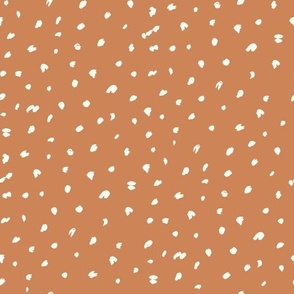 Painted spots white on brown by Jac Slade