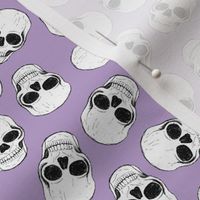 Day of the dead - Skulls freehand sketched realistic bones skull design on lilac purple