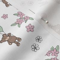 Cute festive raw freehand teddy bear with balloons and ditsy flowers in hazelnut moody green pink on white