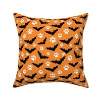 halloween orange bat dog paw print pattern