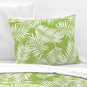 palm leaves on bright green