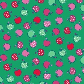 Tossed Ditzy Red, Green, and Pink Polka Dot Apples on Green Ground Non Directional