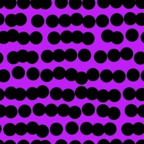 Spots in a line black on purple 
