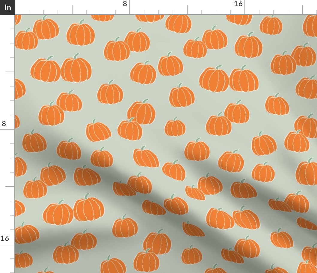 Raw minimalist ditsy pumpkin garden fall design in orange on sage green