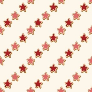 Medium Diagonal Christmas Diagonal Gingerbread Red and Pink Star Cookies with Seashell White Background