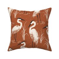 Herons on warm red