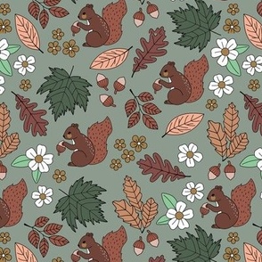 Woodland animals autumn garden red squirrels and leaves acorns and flowers fall kids design green rust red beige on olive
