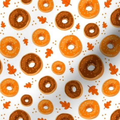 Medium Scale Frosted Pumpkin Spice and Maple Frosted Sprinkle Donuts on White