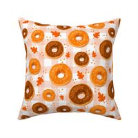 Large Scale Frosted Pumpkin Spice and Maple Frosted Sprinkle Donuts on Gingham