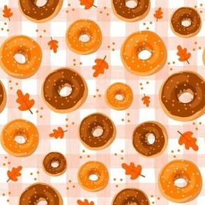 Medium Scale Frosted Pumpkin Spice and Maple Frosted Sprinkle Donuts on Gingham