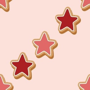 Large Diagonal Christmas Diagonal Gingerbread Red and Pink Star Cookies with Pale Pink  Background