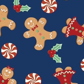 Large Christmas Gingerbread Men and Women surrounded by Holly and Round Peppermint Candy with Blue Background