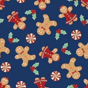 Medium Christmas Gingerbread Men and Women surrounded by Holly and Round Peppermint Candy with Blue Background