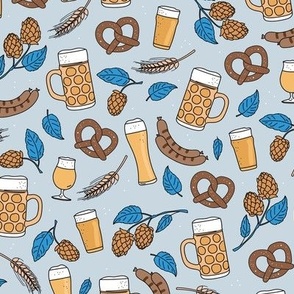 Bavarian blue beer glasses sausages and pretzels traditional german food and drinks oktoberfest theme yellow blue on mist blue