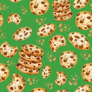 Medium Scale Chocolate Chip Cookies and Crumbs on Green