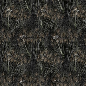 Soft grasses on black woven background