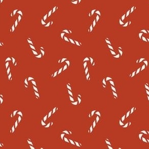 Classic candy canes on Christmas red