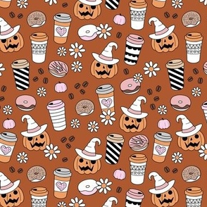 Pimpkin spice and halloween witch fall coffee cups to go boho cutesie vintage drinks and daisies autumn blossom pink orange on sienna rust