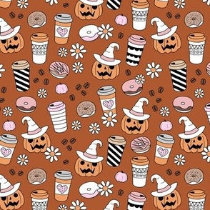 Pumpkin spice and halloween witch fall coffee cups to go boho cutesie vintage drinks and daisies autumn blossom pink orange on sienna rust