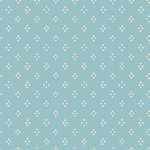 4 cream dots in a diamonds shape on a blue background