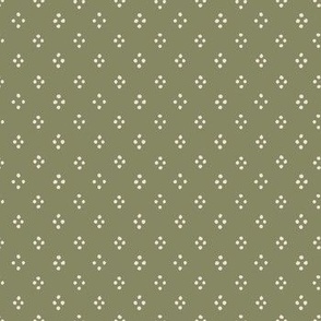 4 cream dots in a diamonds shape on a green background