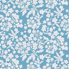 Ditsy White Blooms on a blue background