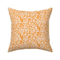 Ditsy White Blooms on an orange background