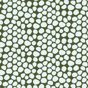 light blue and brown spots and dots on dark green