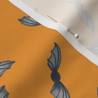 Hand painted Halloween bats in grey on orange for kids clothing and accessories