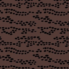 Abstract deer sports wild animal print Scandinavian neutral nursery trend black on chocolate brown