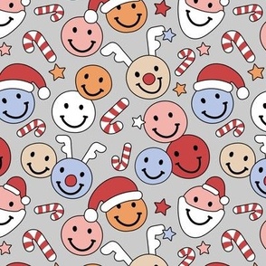 Happy Holidays candy canes - Christmas smiley stars santa hats reindeer and stars red orange blue on gray