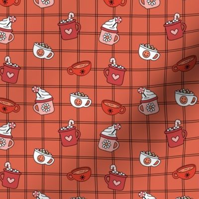 Pumpkin spice and hot chocolate cups of coffee and tea autumn winter cutesie retro seventies design red blush on orange