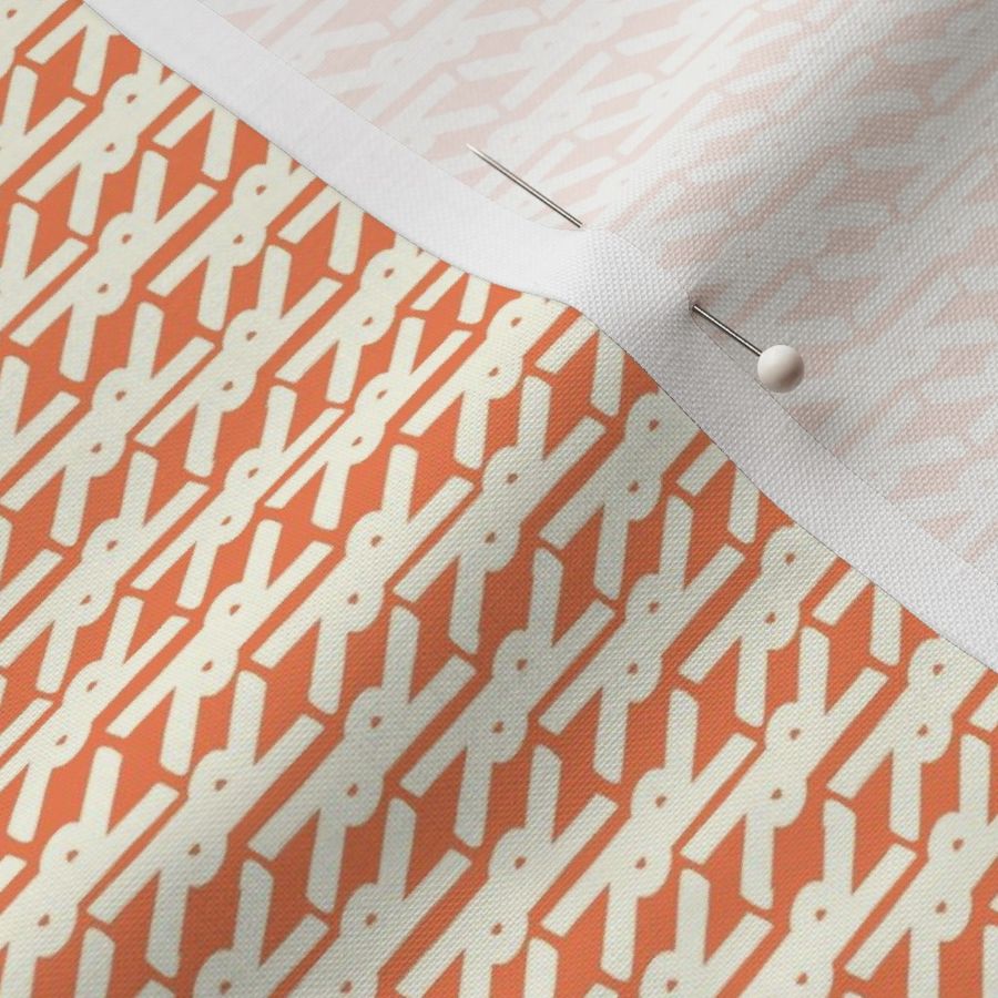 Bright symmetrical geometric scissor shape in orange and white