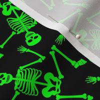 Small Bright Green Dancing Halloween Skeletons Scattered On Black