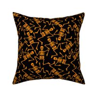 Small Bright Orange Dancing Halloween Skeletons Scattered On Black