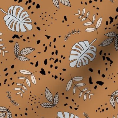 Jungle leaves and cheetah spots tropical monstera branches and botanical plants natural earthy boho theme nursery freehand gray neutral beige on burnt orange