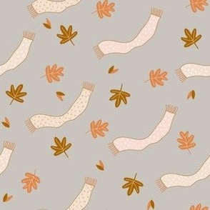Tiny Autumn Leaves and Scarf in the Wind on gray