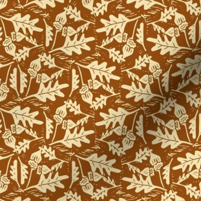 Fall oak leaves and acorns in cream on a burnt orange background block printed